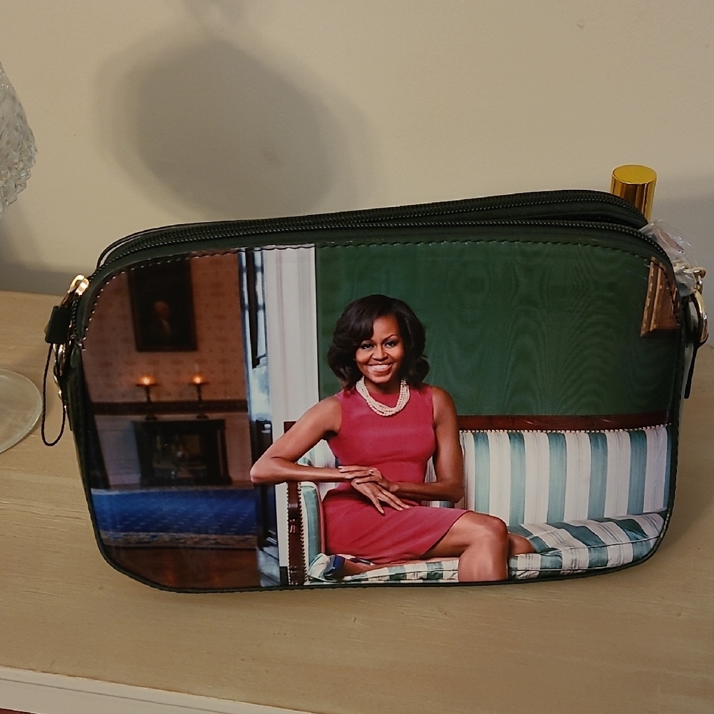 Sleek Black and Red Crossbody Bag with Zipper Closure